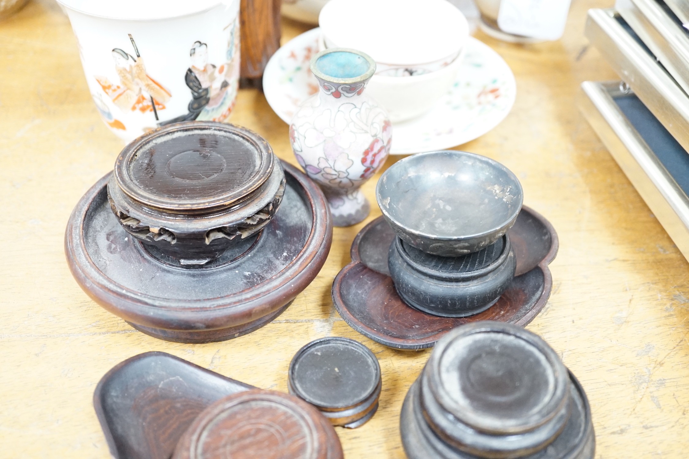 A group of Japanese Satsuma pottery, other ceramics, wood stands etc, a pair of vases 18cms high